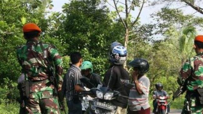 Two policemen, guard shot dead near US mine in Indonesia